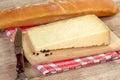 Cantal cheese and baguette on the table