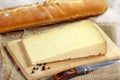 Cantal cheese and baguette on the table