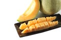 Slices cantaloupe melon fruit in blackdish. Royalty Free Stock Photo