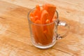 Slices carrots in transparent glass cup