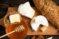 Slices of cheese brie or camembert with croissants Royalty Free Stock Photo