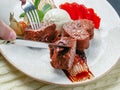 Slices of chocolate fondant close-up on a plate with a scoop of ice cream and strawberries Royalty Free Stock Photo