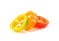 Slices of colorful bell pepper on white background Royalty Free Stock Photo