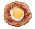 Slices of cooked bacon with fried egg isolated on a white background, top view, close-up Royalty Free Stock Photo