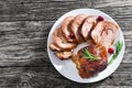 Slices of delicious barbecue turkey roulade with cranberry