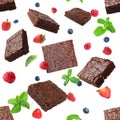 Slices of delicious chocolate brownie with fresh berries and mint flying on white background