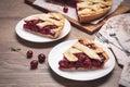 Slices of delicious fresh cherry pie served on wooden table, closeup Royalty Free Stock Photo