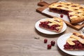 Slices of delicious fresh cherry pie served on wooden table. Space for text Royalty Free Stock Photo