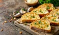 Slices of delicious garlic bread on rustic background Royalty Free Stock Photo