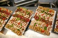 Slices of different types of meat on a wooden board. Royalty Free Stock Photo