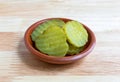 Slices of dill pickles in a small bowl Royalty Free Stock Photo