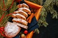 Slices of Dresden Stollen with dried cranberies and nuts. Festive European dessert. Christmas baking concept. Top view. Royalty Free Stock Photo