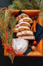 Slices of Dresden Stollen with dried cranberies and nuts. Festive European dessert. Christmas baking concept. Top view. Royalty Free Stock Photo