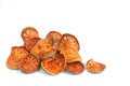 Slices of dried bael fruit on white Royalty Free Stock Photo