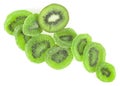 Slices of dried kiwi and fresh kiwi fruit isolated on white background, top view. Dried candied kiwi fruit slices Royalty Free Stock Photo