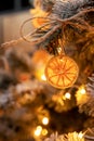 Slices of dried oranges decorate the Christmas tree, close-up Royalty Free Stock Photo