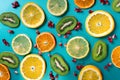 Slices of exotic fruits on blue table Royalty Free Stock Photo