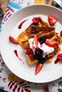 Slices of finnish pancake served with cream and fruits