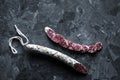 Slices of french saucisson salami on a grey background. Royalty Free Stock Photo