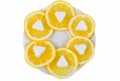 The slices of fresh and bright yellow lemon and sugar with shape as a heart on a white plate Royalty Free Stock Photo