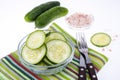 Slices of fresh cucumber in glass bowl. Royalty Free Stock Photo