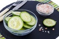 Slices of fresh cucumber in glass bowl. Royalty Free Stock Photo