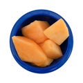 Slices of fresh cut cantaloupe in a blue bowl Royalty Free Stock Photo