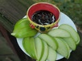 Slices fresh green apple with dipping sauce