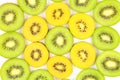 Slices of fresh green and yellow kiwi fruits food background texture Royalty Free Stock Photo