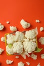 Slices of fresh juicy cauliflower in basket on orange background Royalty Free Stock Photo