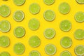 Slices of fresh juicy limes on background, flat lay Royalty Free Stock Photo