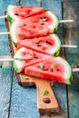 Slices of fresh juicy watermelon on a cutting board with mint Royalty Free Stock Photo
