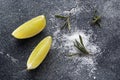 Slices of fresh lime, salt and rosemary dark concrete background. Copy space. Ingredients for making a tequila cocktail Royalty Free Stock Photo