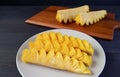 Slices of fresh ripe pineapple in a white plate ready to serve Royalty Free Stock Photo