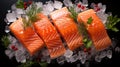 Slices of fresh salmon on a wooden cutting board with lemon slices, herbs, cherry tomatoes on a branch, olives, red