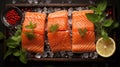 Slices of fresh salmon on a wooden cutting board with lemon slices, herbs, cherry tomatoes on a branch, olives, red