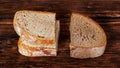 Slices of fresh and stale bread on a dark wooden background_