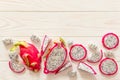 Slices of fresh white pitaya or dragon fruit on wooden background, top view Royalty Free Stock Photo