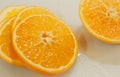 Slices of freshly cutted orange for backgrounds Royalty Free Stock Photo