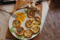 Slices of fried marrow type pumpkin and a bunch of garlic