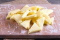 Slices of frozen pineapple on a cutting board on a table Royalty Free Stock Photo
