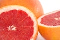 Slices of grapefruit macro closeup on white background Royalty Free Stock Photo
