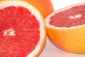 Slices of grapefruit macro closeup on white background Royalty Free Stock Photo