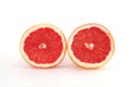 Slices of grapefruit macro closeup on white background Royalty Free Stock Photo