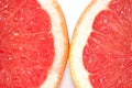 Slices of grapefruit macro closeup on white background Royalty Free Stock Photo