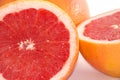 Slices of grapefruit macro closeup on white background Royalty Free Stock Photo