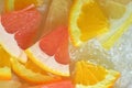 Slices of grapefruit, orange fruit and honey pomelo in water on white background. Pieces of grapefruit, orange fruit and Royalty Free Stock Photo