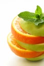 Slices green apple and orange Royalty Free Stock Photo