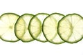 Slices of green fresh lime on the lumen. Royalty Free Stock Photo
