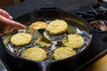 Slices of green tomato being fried Royalty Free Stock Photo